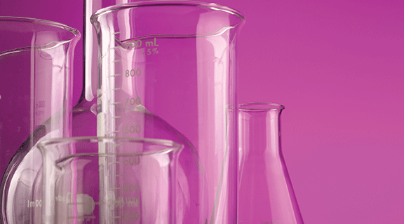 Chemistry glassware with a hot pink background